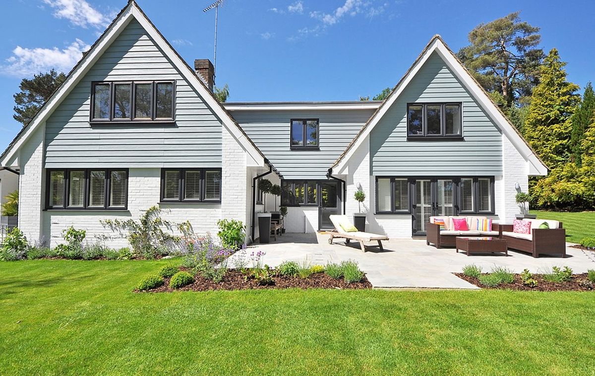 Bright two-storey home with lap siding and a landscaped yard